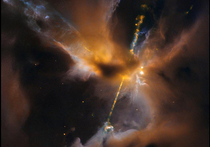Космический телескоп Hubble отправил на Землю снимок, который выглядит словно кадр из новой части фильма «Звёздные войны»: огромный световой меч прорезает тёмные облака пыли и газа посреди космоса