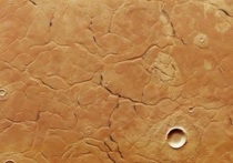 Исследователи, представляющие Европейское космическое агентство, опубликовали изображение, на котором можно увидеть необычную сеть лабиринтов на поверхности Марса