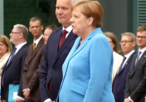 В интервью радиостанции Antenne Bayern специалист по чтению по губам Джудит Хартер пояснила, что пыталась сказать федеральный канцлер Германии Ангела Меркель очередного приступа дрожи