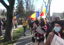 В Кишиневе президента Румынии встретили унионистскими выкриками