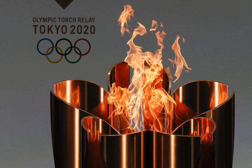 В Японии снова идет эстафета олимпийского огня: лучшие фото 