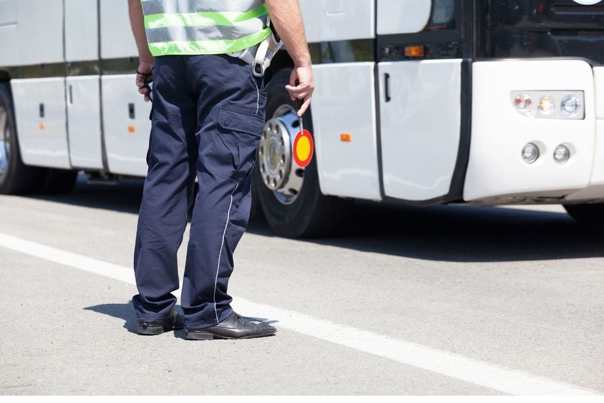 Police Officer controlling Traffic. What does a policeman do.