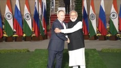 Улыбающийся Путин без маски прилетел в Индию: кадры визита