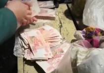 Полиция нашла тайник, в котором кассирша из Ачинска, похитившая по месту работы в банке 23 миллиона рублей, хранила украденное