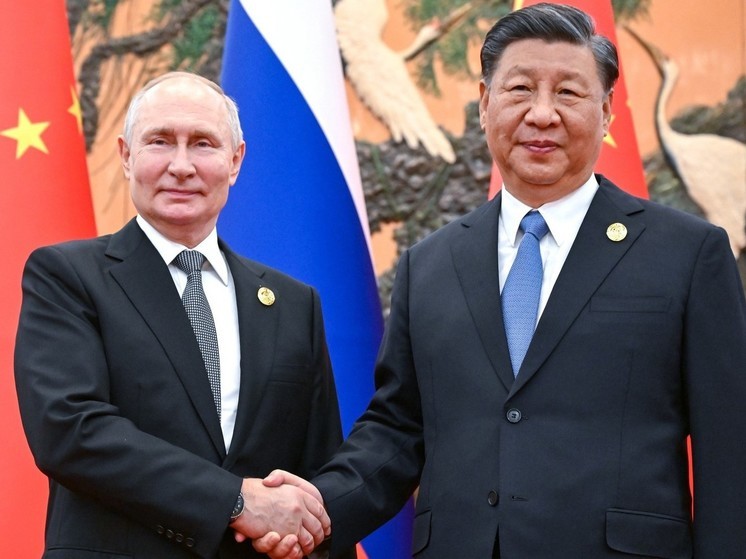 Ушаков: визит Путина в Китай будет ответом на приезд Си Цзиньпина