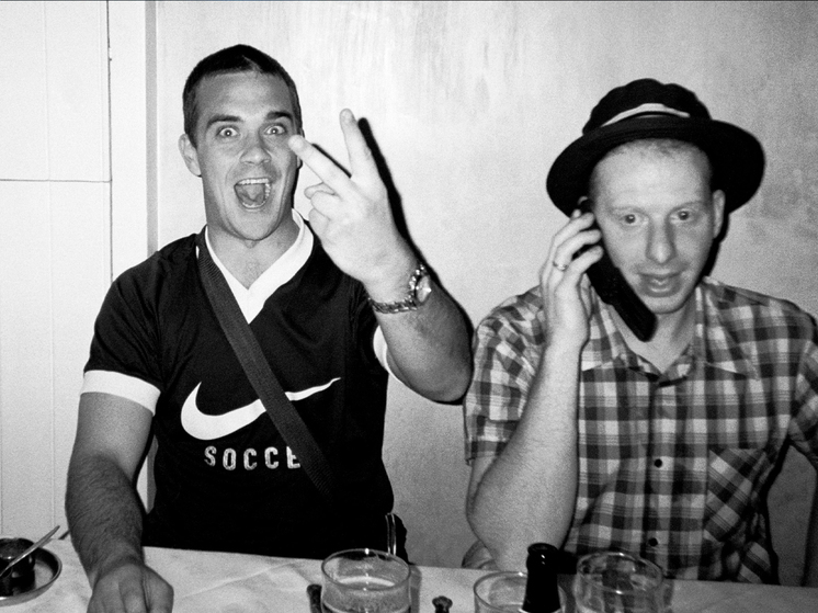 Robbie Williams and Gary Barlow, reunited after a 30-year hiatus.