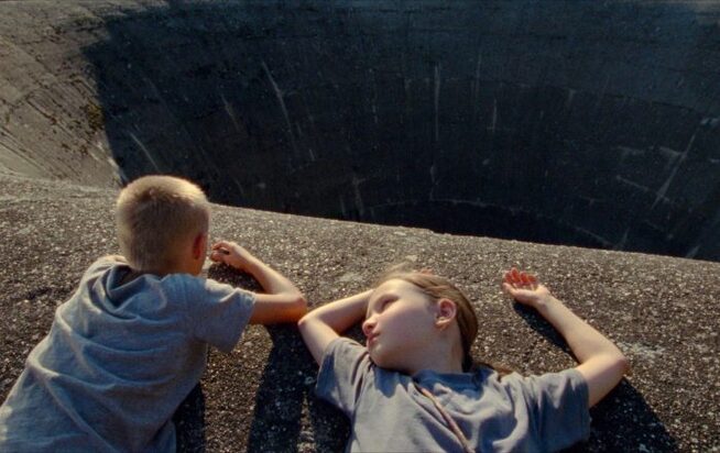 Still from `Short Summer` by Nastya Korkia, depicting a rural scene with a young girl.