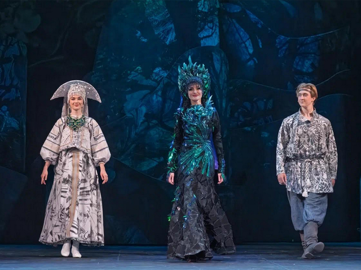 The Mistress of the Copper Mountain on stage, illuminated.