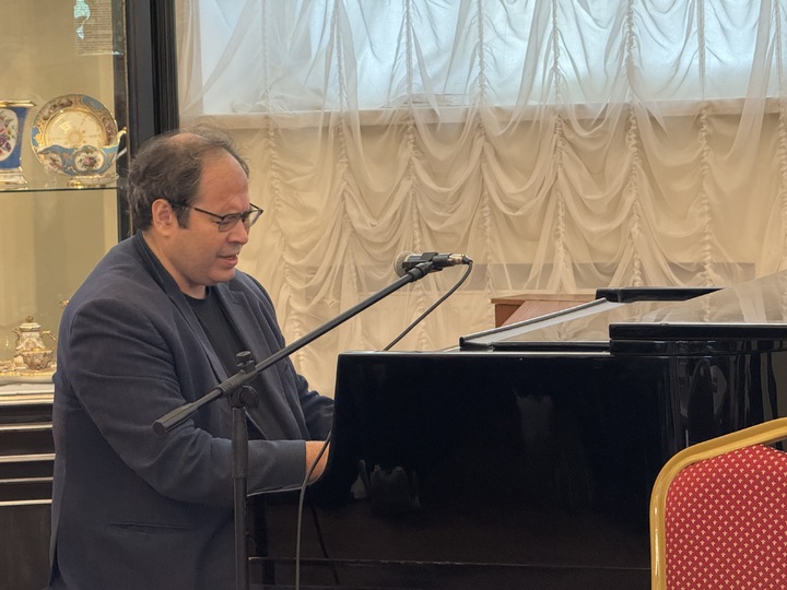 Mikhail Zamshev performing at the piano