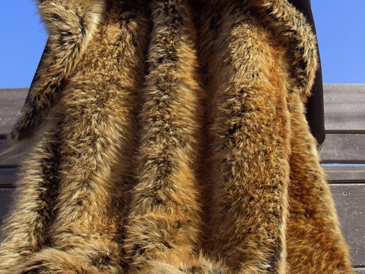 A collection of clothes and accessories made from synthetic materials, often labeled as `vegan leather` or `eco-leather`.