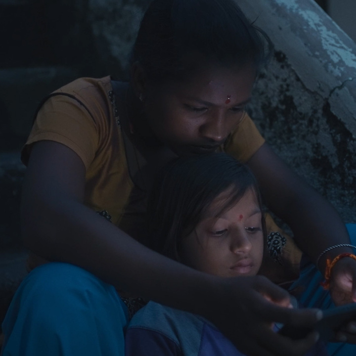 Still from the film `Bali` showing a young girl playing kabaddi.