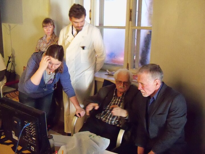 Khutsiev reviewing footage intently on a monitor