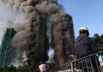 Число погибших при пожаре в высотках в Гонконге возросло до 44 человек, но сотни жильцов сгоревшего жилкомплекса по-прежнему числятся пропавшими без вести
