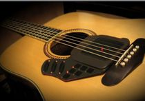 Американец Пол Во изобрел акустическую гитару нового типа