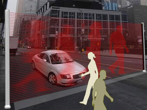 Лазерная подсветка системы Virtual Wall создает изображение идущих пешеходов прямо на проезжей части около стоп-линии