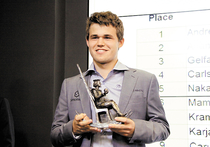 Чемпион Карлсен и «малыш» Каруана