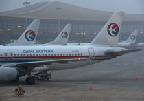 В Китае пассажиры самовольно открыли дверь самолета и были арестованы